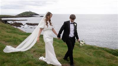 Couple walking by the sea