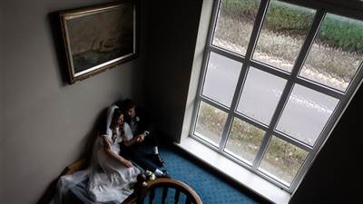 Couple sitting by the window