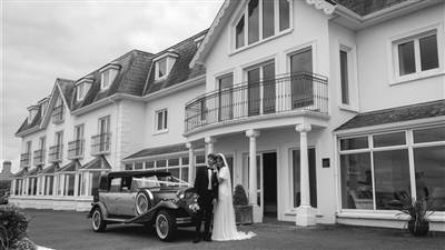Couple outside with vintage car