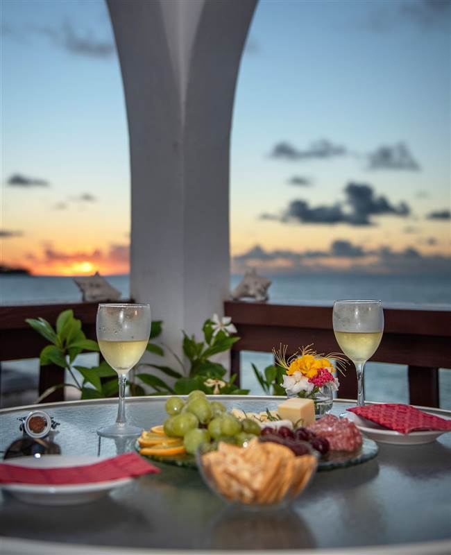 Anguilla Stay, Relaxed sunset dinner on your beach front balcony