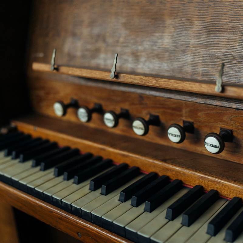 wooden organ with black and white keys