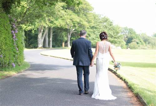 Wedding couple walking in the park